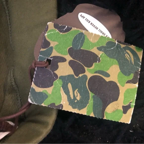 A BATHING APE GREEN 1ST CAMO SWEATS W/ EMBROIDERED LETTERS IN WHITE SZ. M